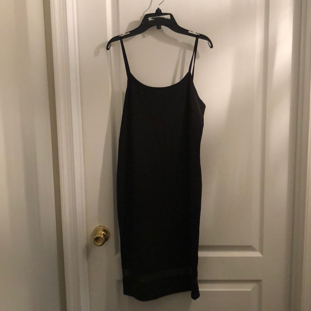 Black dress with sheer hem detail